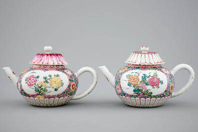 A pair of Chinese famille rose teapots on stand, Yongzheng/Qianlong, 18th C.